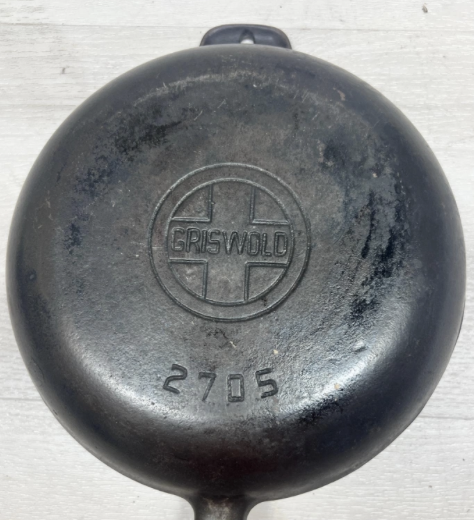 Botom of Griswold cast iron Chef's Skillet with Bakelite handle, pattern number 2705, sold for $500.t